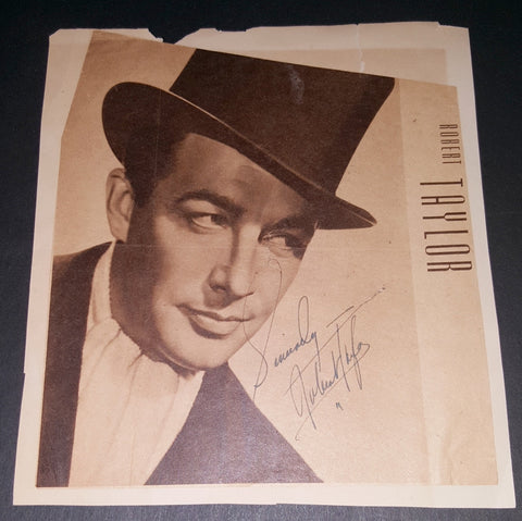 RARE ACTOR ROBERT TAYLOR (D.1969) HAND SIGNED VINTAGE NEWSPAPER PHOTO (APPROXIMATE 8X10" OVERALL SIZE)